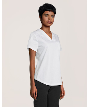 Haut d'uniforme médical avec encolure en V et poche à porter dans le pantalon pour femmes